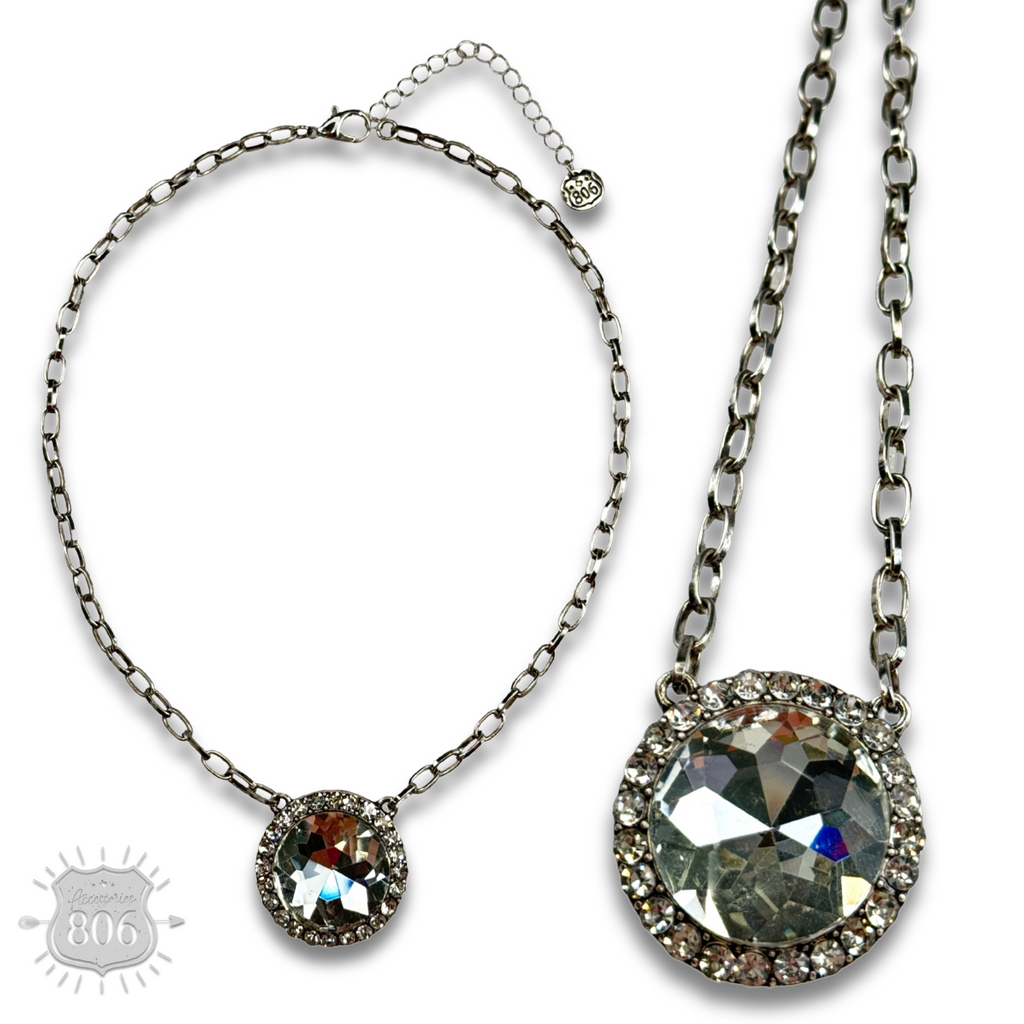 Large round pendant on silver link chain necklace
